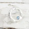 silver halo ring with topaz